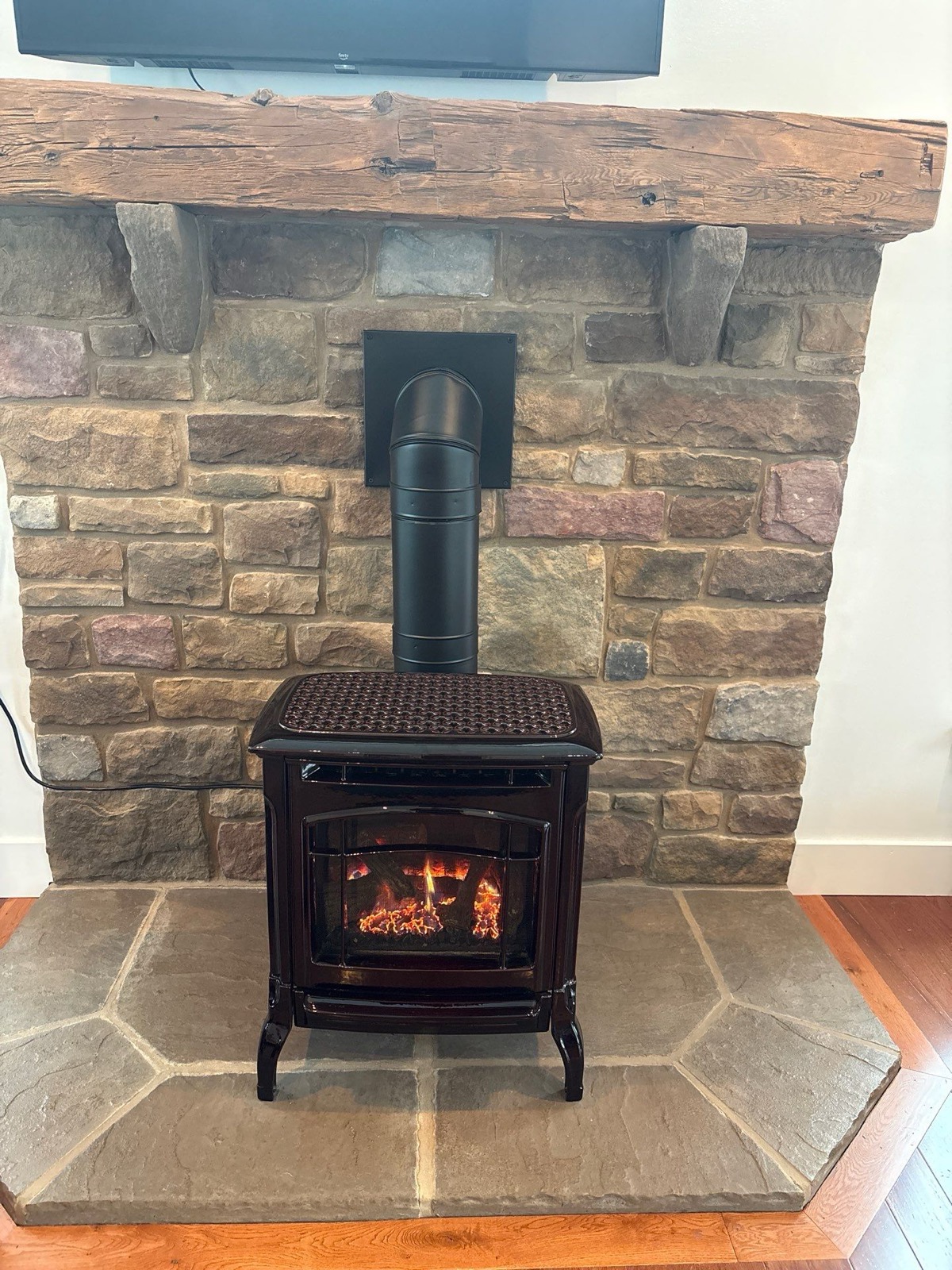 Hearthstone gas stove · into a stone wall